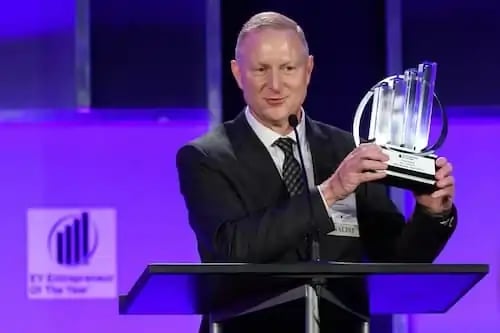 Kyle stavig accepts Entrepreneur of the Year award