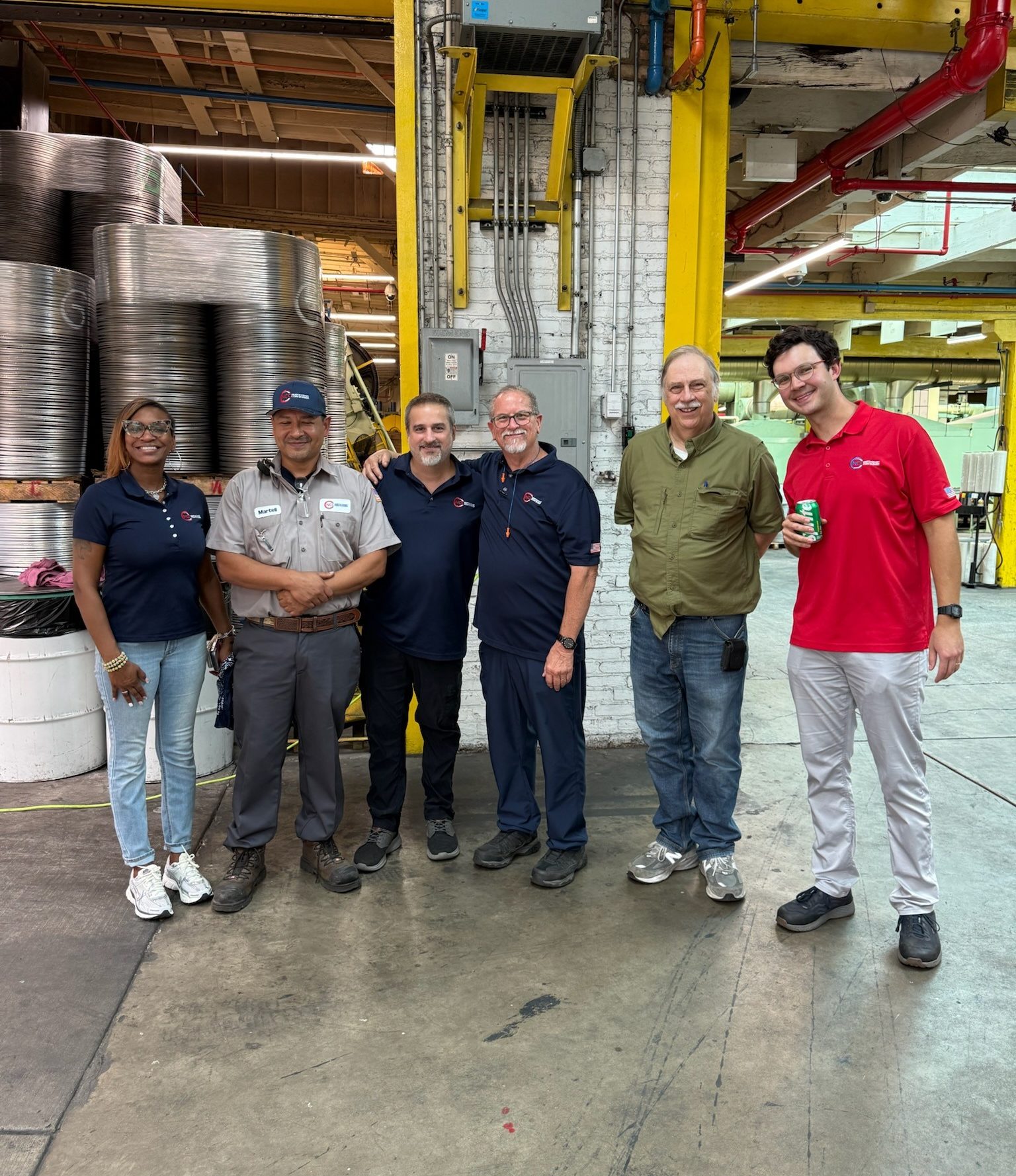 NCC team on manufacturing floor.