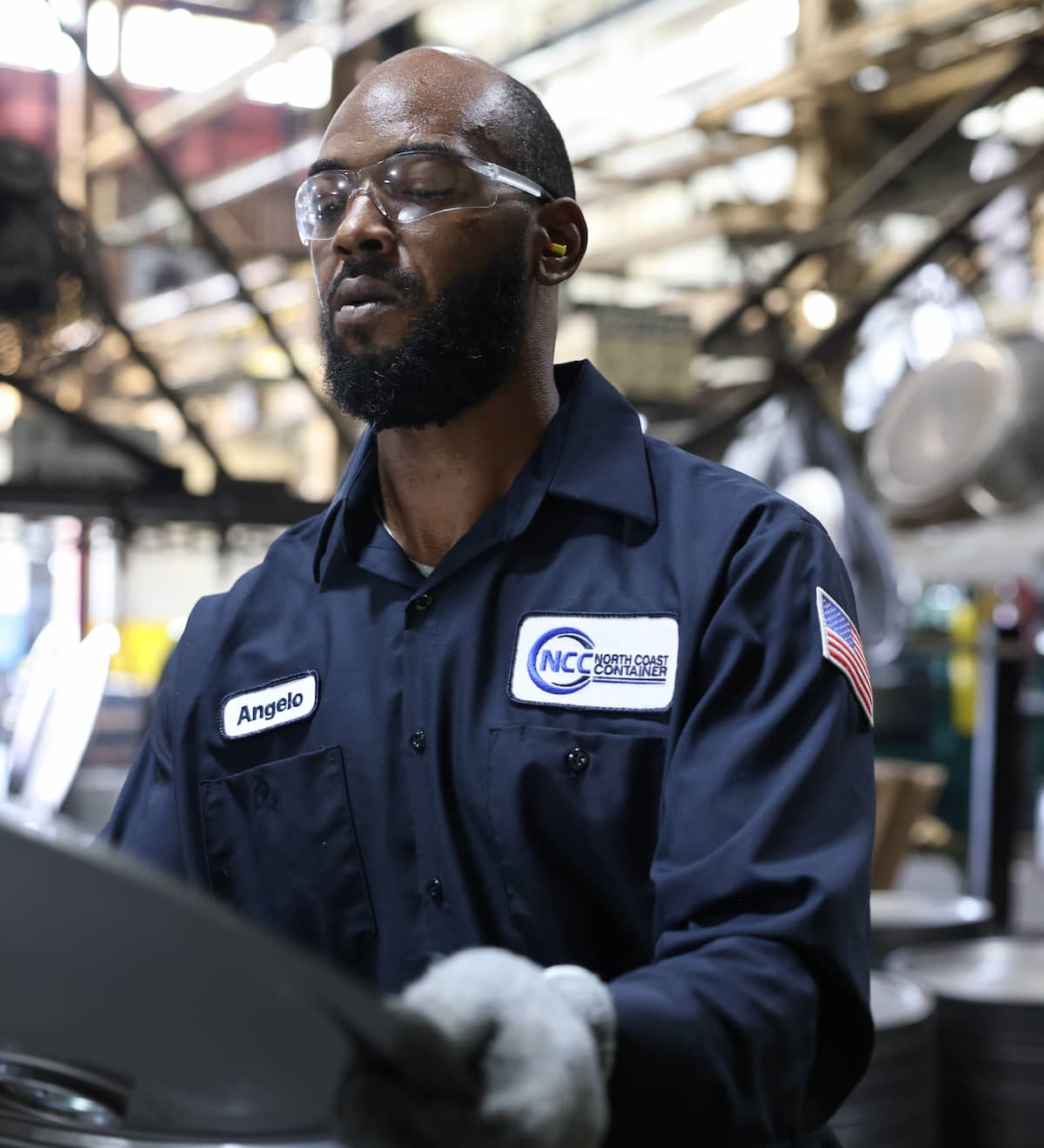 Employee working with sustainable steel drum covers