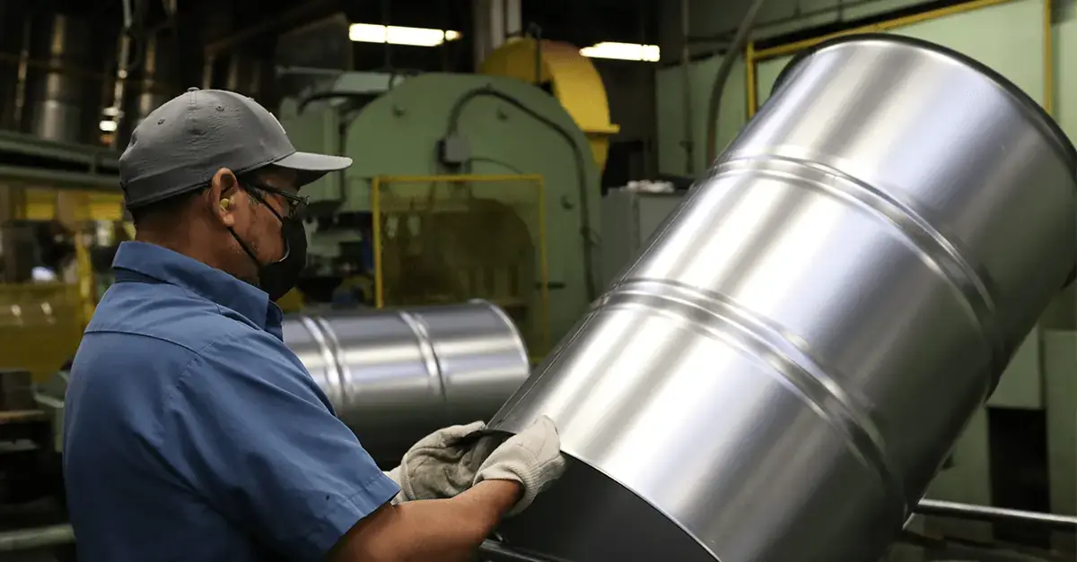 NCC team member working on a lighter-weight 55-gallon steel drum