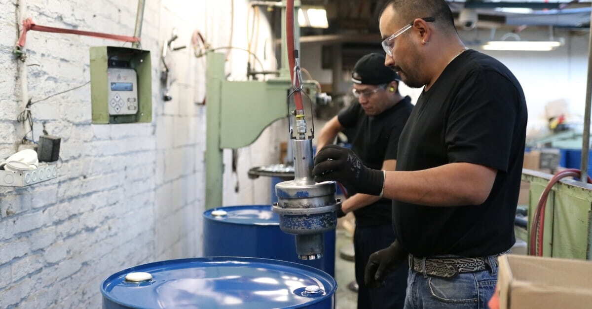 Steel drums for specialty chemicals and hazardous materials on production line at NCC manufacturing facility